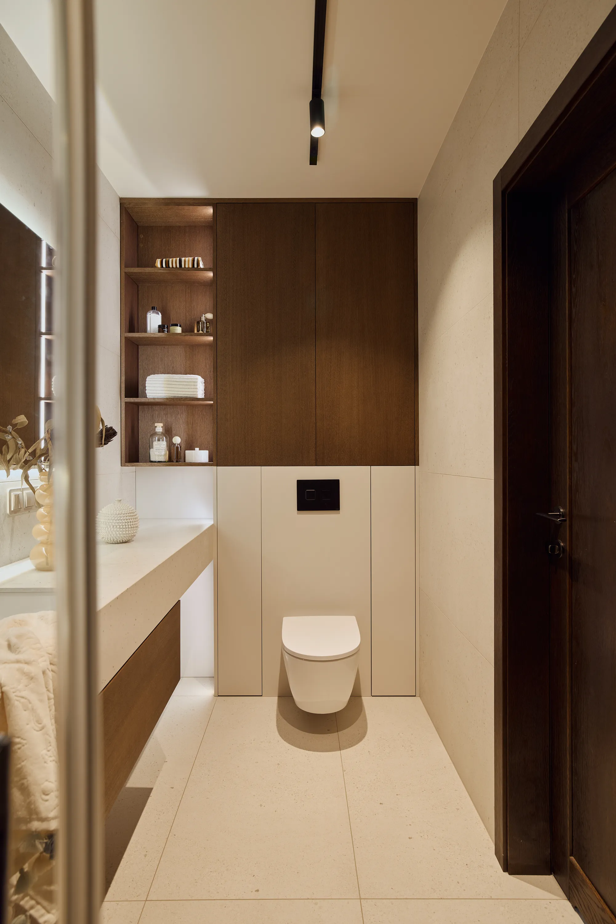 Walnut cabinetry with curved profiles and refined finishing