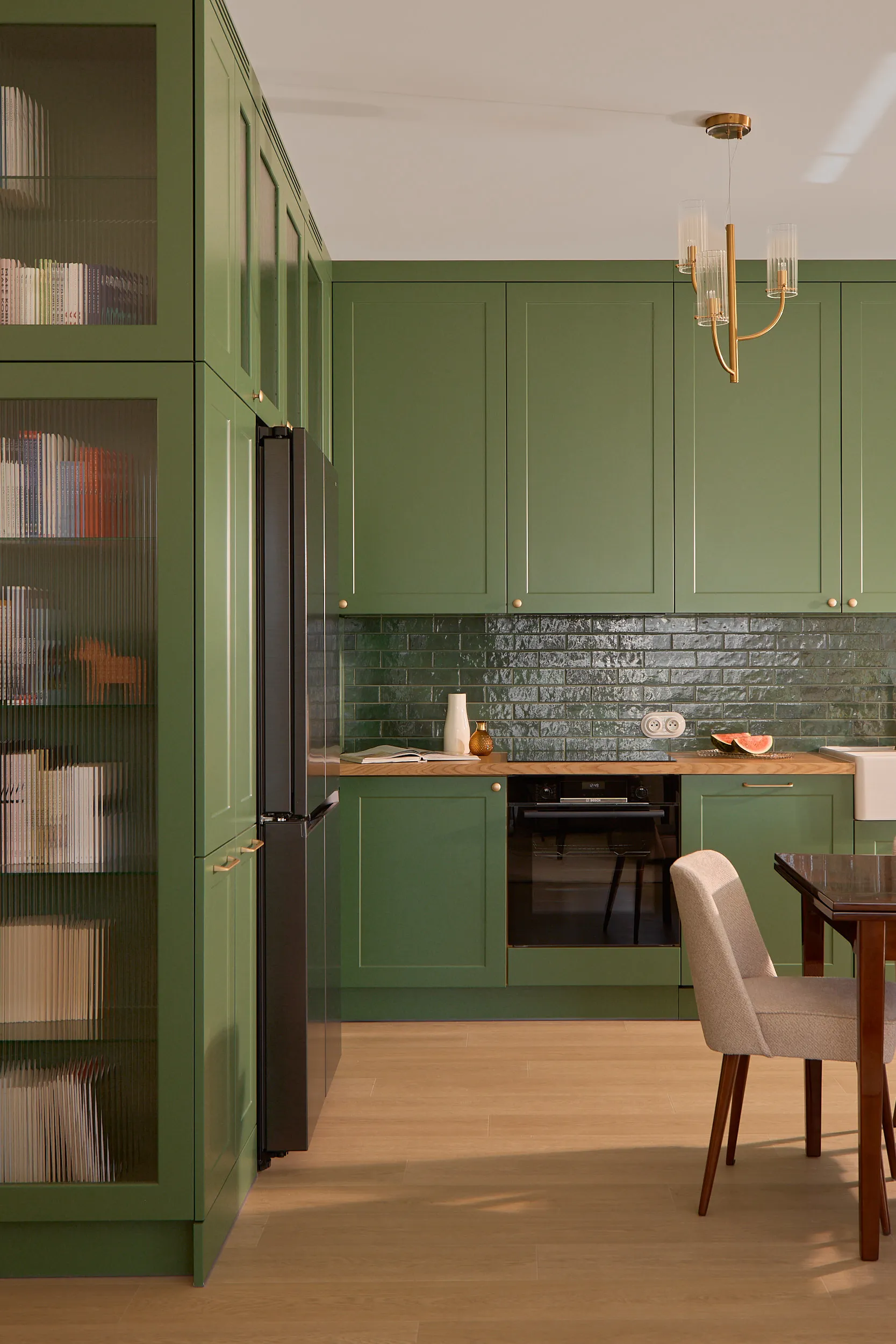 Sage green kitchen detail with hand-selected hardware