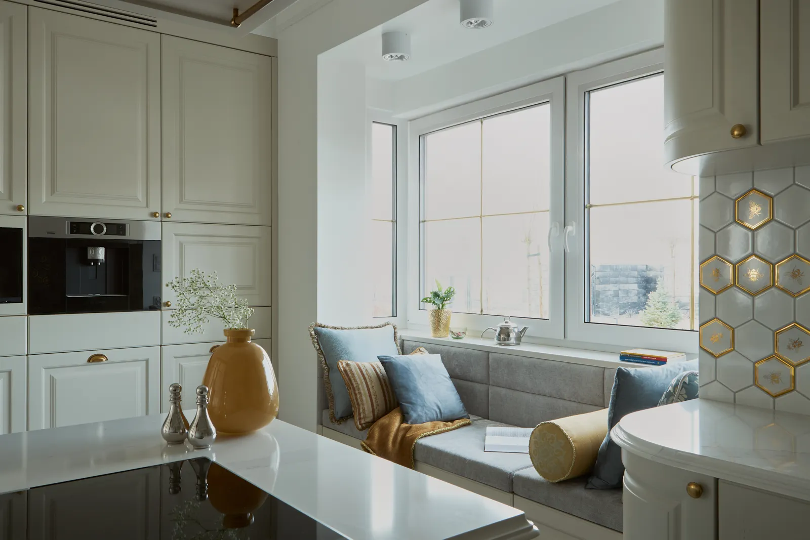 Traditional European kitchen with brass hardware and inset cabinetry